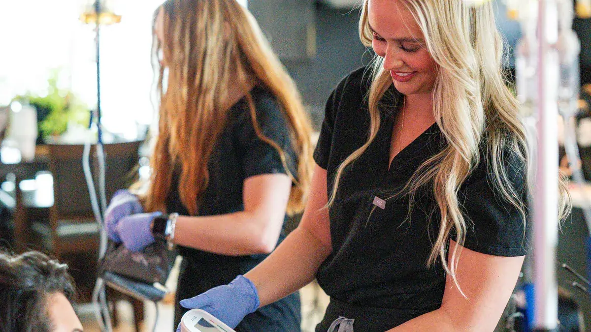 Two licensed Drip Lab nurses providing mobile IV therapy in Nashville
