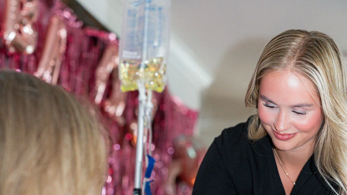 Drip Lab TN nurse applying a blood-pressure cuff before IV therapy in Hillsboro Village Nashville